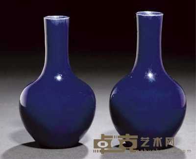 Kangxi A pair of deep blue glazed bottle vases 